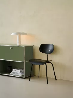 The SE 68 multi purpose chair next to a USM shelf